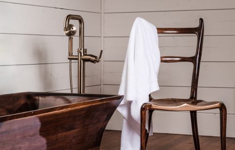 Pearl Chair with towel draped over it next to Black Walnut Tub